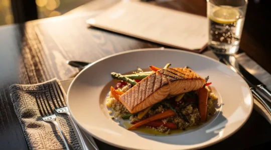 Strategic view of a restaurant table setting with colorful vegetables and lean protein elegantly plated